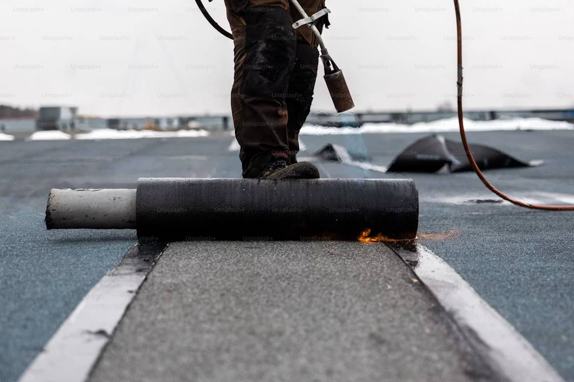 Roofing underlayment being installed on a roof deck